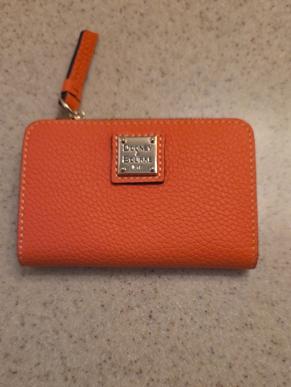 Dooney & Bourke Orange Pebbled Leather Zip Wallet with Logo Plaque